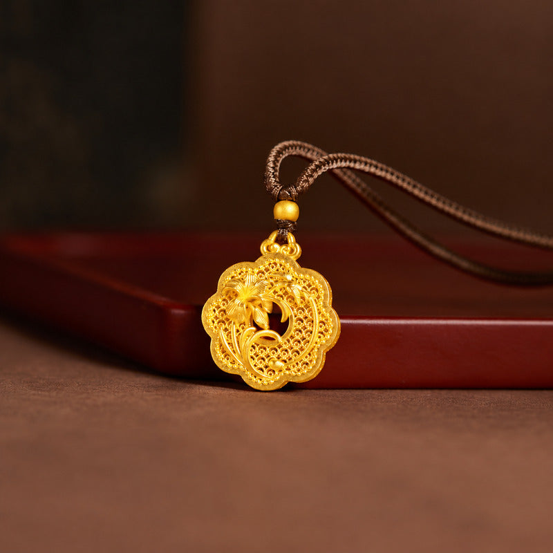 Front view of orchid filigree pendant resting on a red prop
