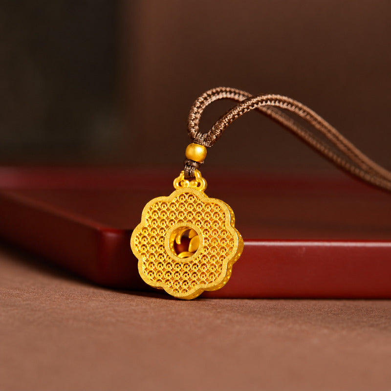 Reverse view of the scalloped filigree pendant