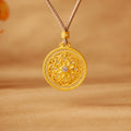 Sunflower compass pendant on a warm golden background