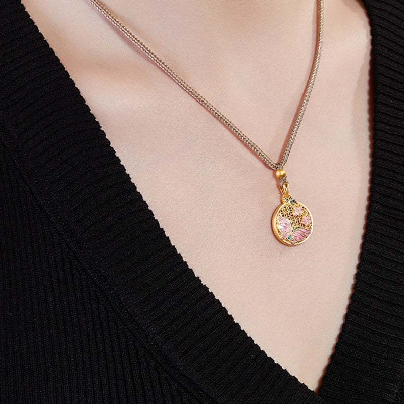 Angled model view of the butterfly medallion on its braided cord