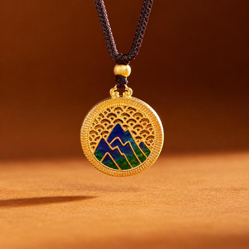 Mountain landscape pendant suspended above a warm amber background