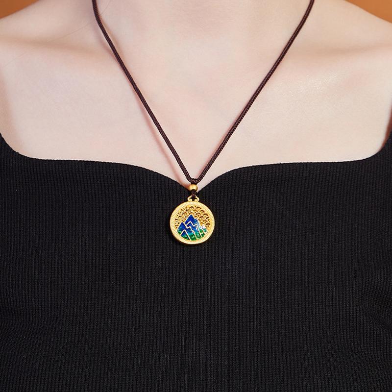 Front wearing view of the mountain landscape necklace