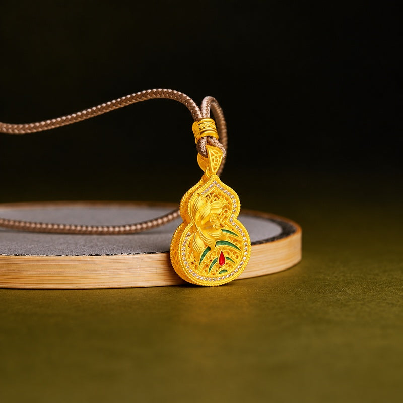 Lotus gourd pendant with green enamel resting against a round display