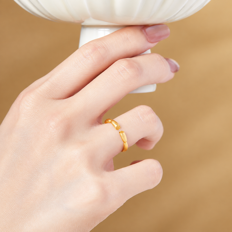Original supplier model wearing lotus root ring while holding a ceramic bowl