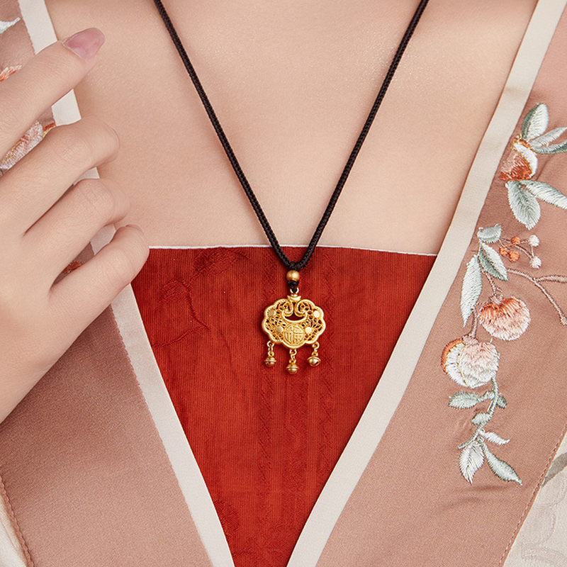 Original model wearing the peace lock bell necklace