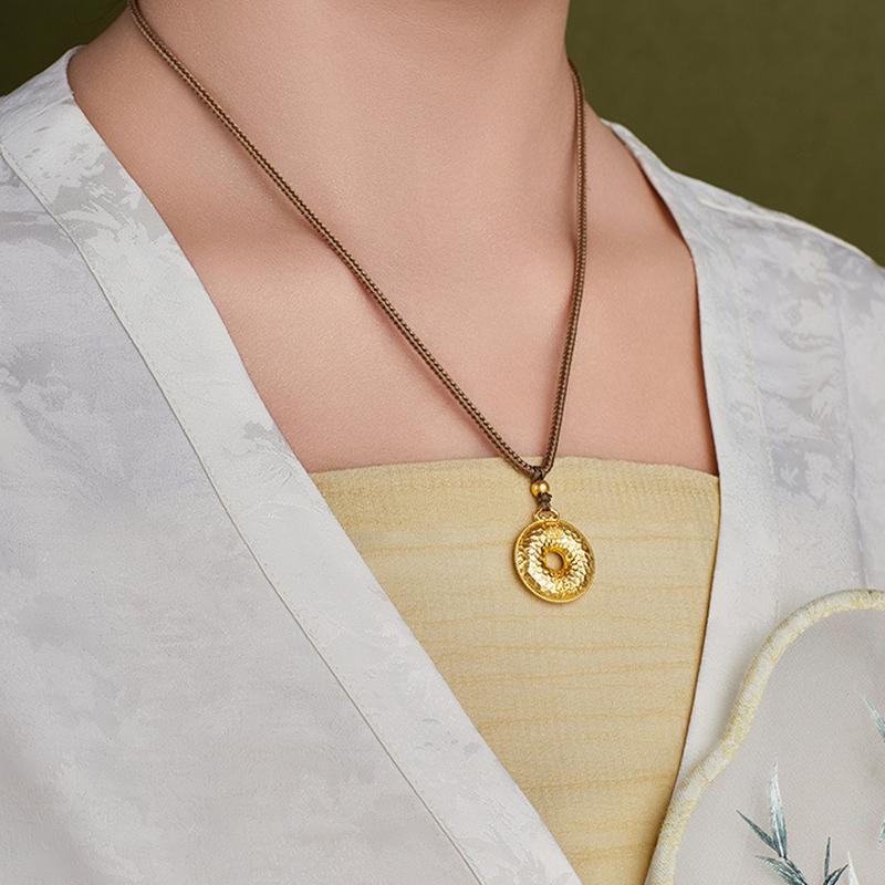 Original model wearing the peace buckle necklace on a brown braided cord