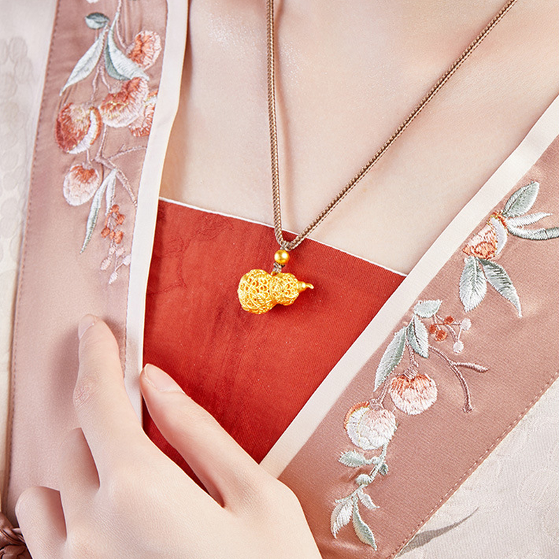Original model wearing the filigree vine gourd necklace