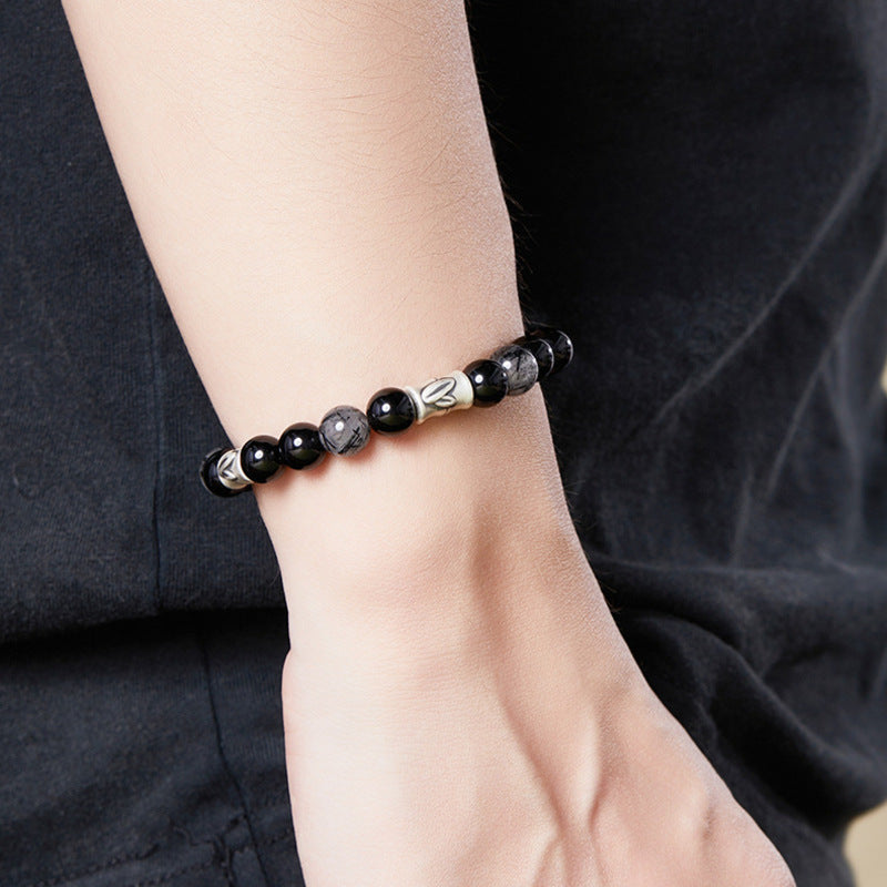 Bamboo black obsidian bracelet worn on wrist