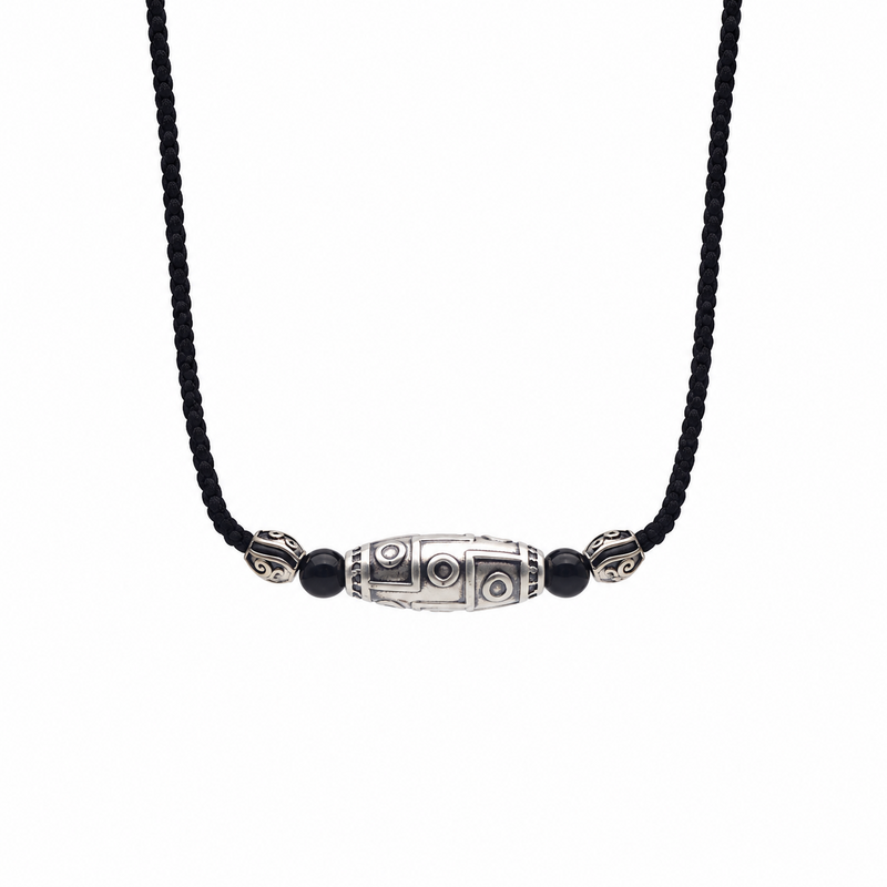 Front view of the nine-eye Dzi necklace on a white background