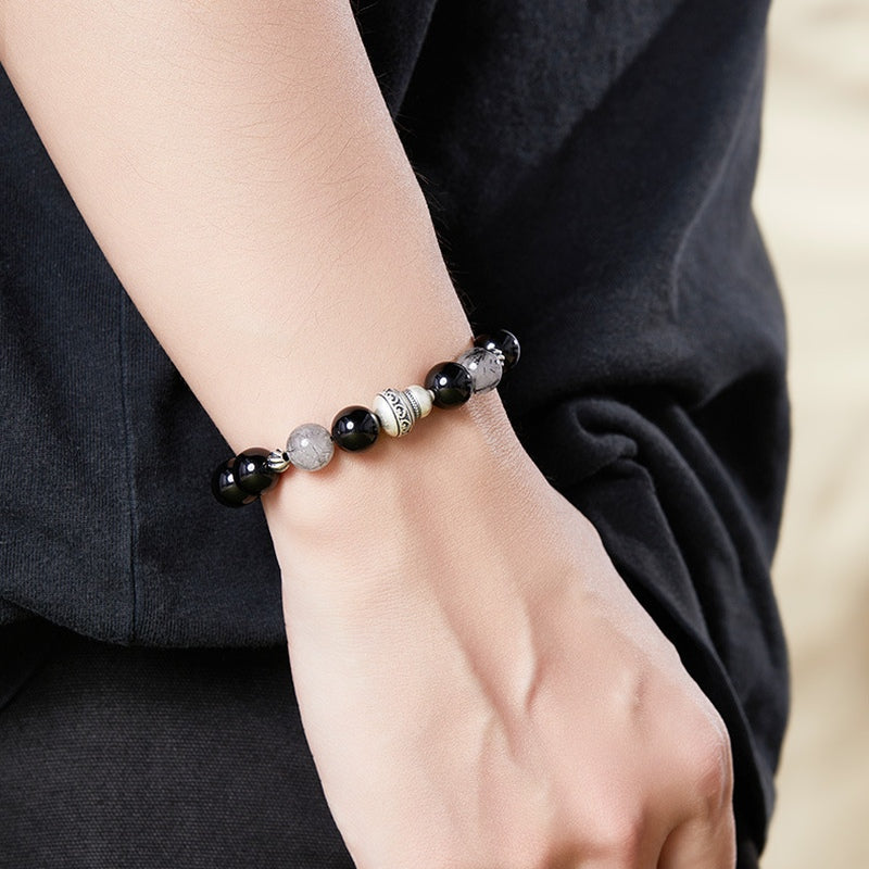 Original model wearing the silver gourd obsidian bracelet