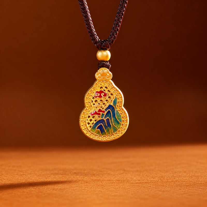 Enamel landscape gourd necklace hanging against a warm brown background
