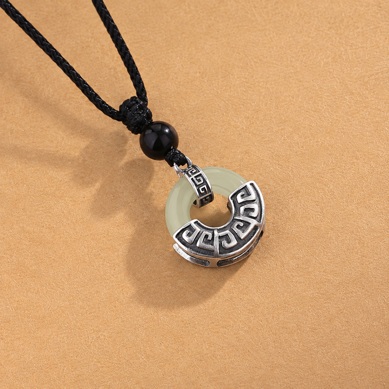 Peace buckle pendant with black obsidian bead and patterned silver bail