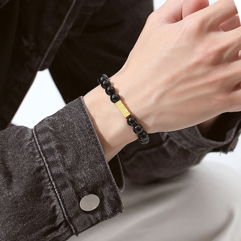 Original model wearing the black obsidian blessing bar bracelet