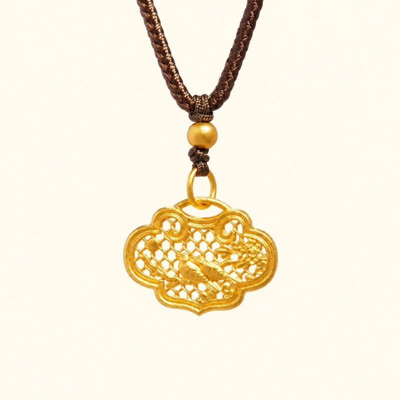 Single magpie ruyi lock pendant against a cream background