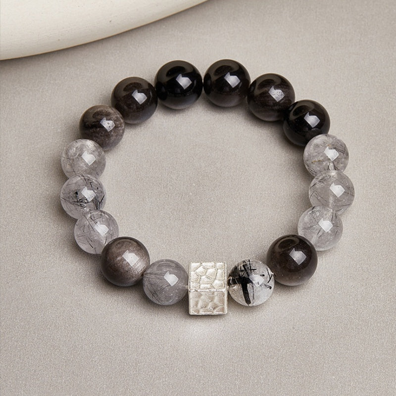 Overhead view of the quartz and obsidian bracelet