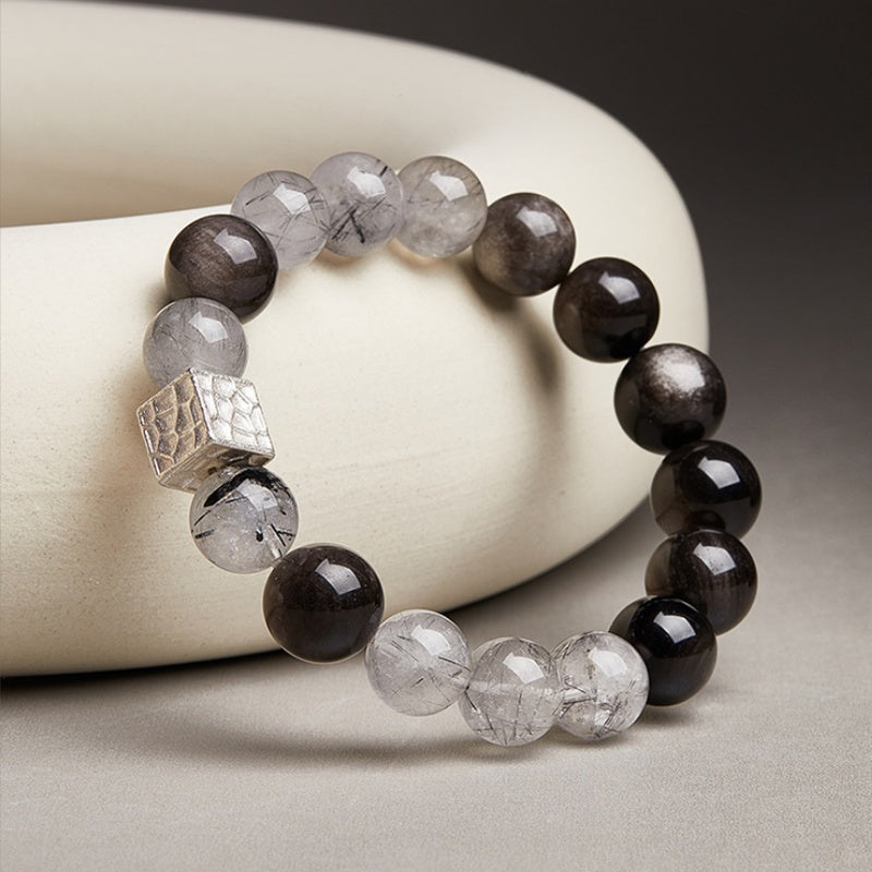Angled bracelet view showing the textured silver focal bead