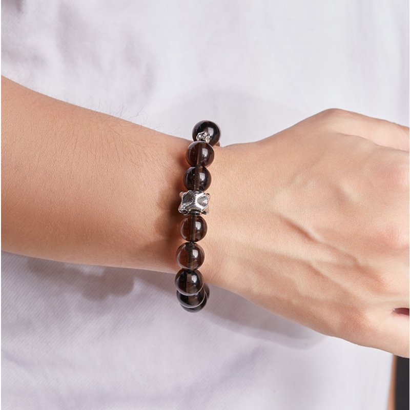 Bracelet worn on a wrist with a white shirt