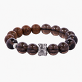 Complete obsidian and golden silk wood bracelet on a light background