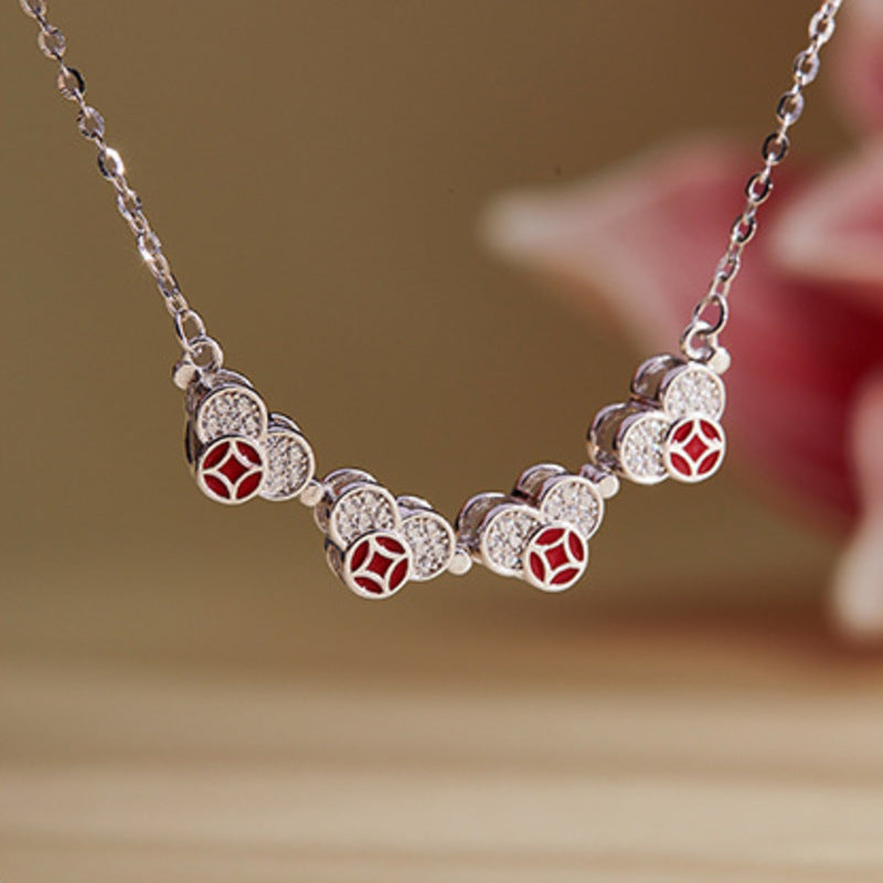 Magnetic necklace unfolded into four connected hearts