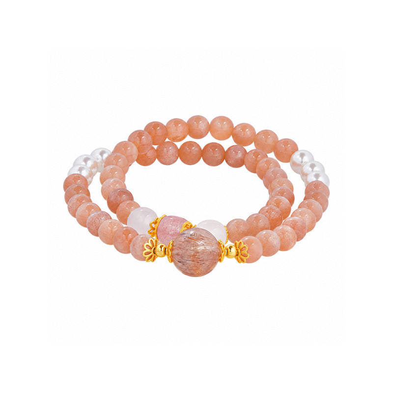 Sunstone and freshwater pearl double-wrap bracelet on white