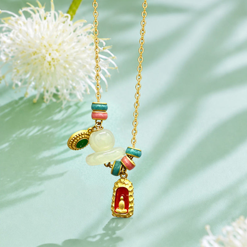 Nephrite jade Buddha necklace in soft green setting