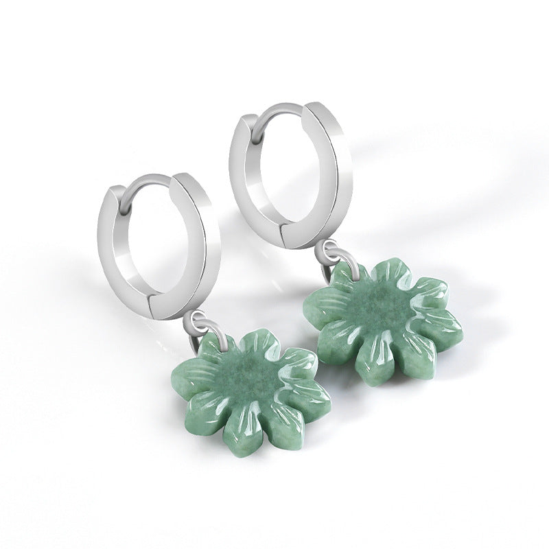 Green jade sunflower earrings arranged upright on a clean white background with details visible