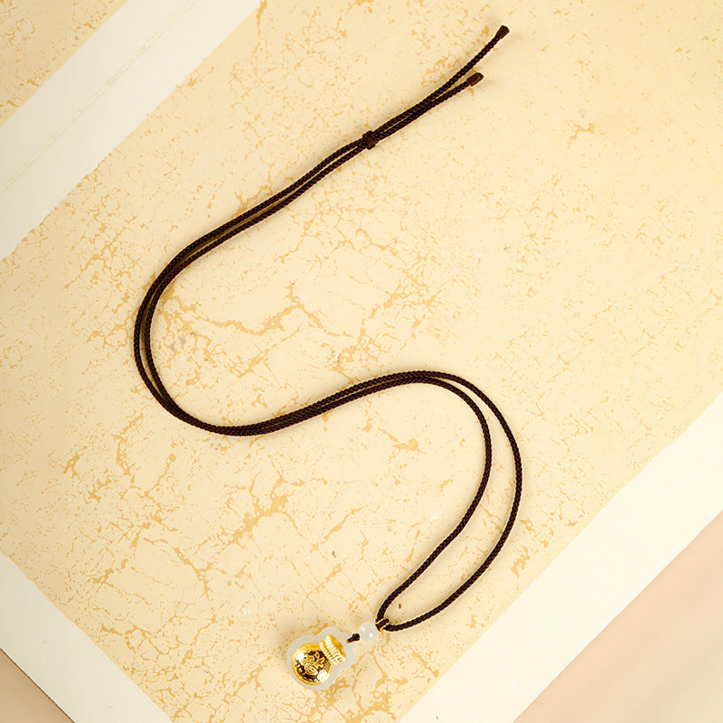 Full dark brown cord fortune pouch necklace in overhead view