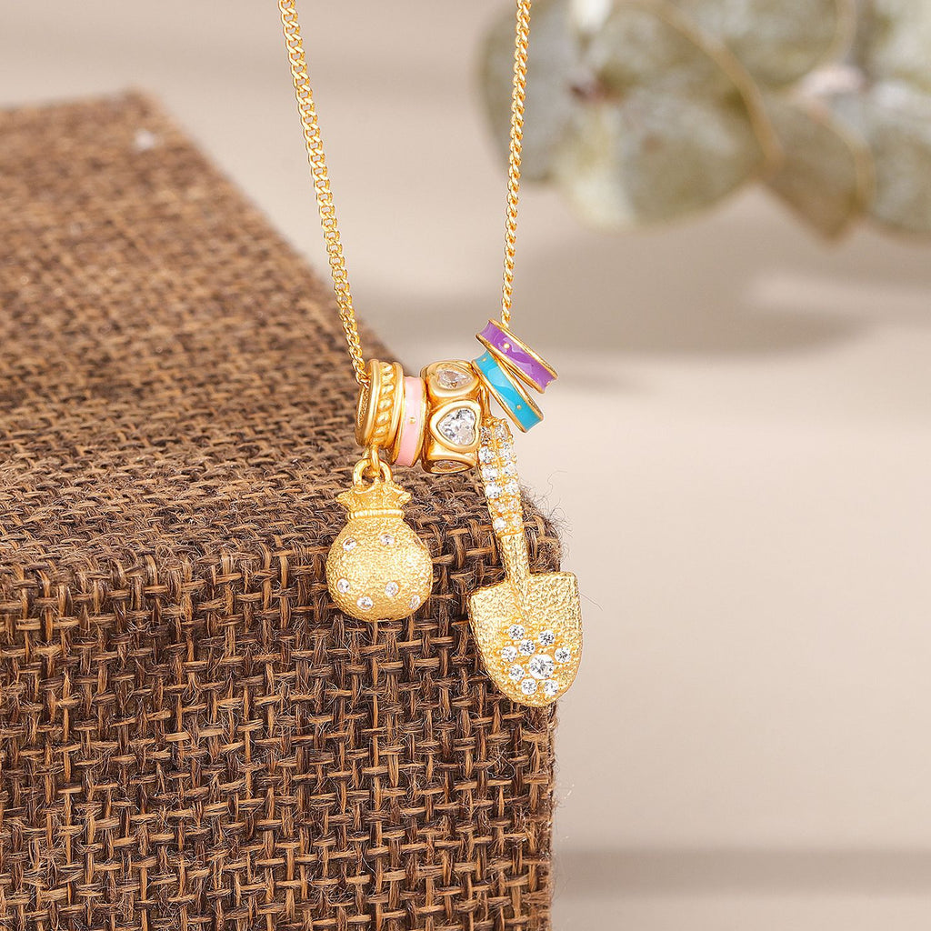 Gold Shovel & Blessing Pouch Necklace – Dig for Joy and Blessings