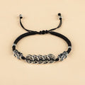 Black cord bracelet variation with five silver coins and matching Pixiu charms