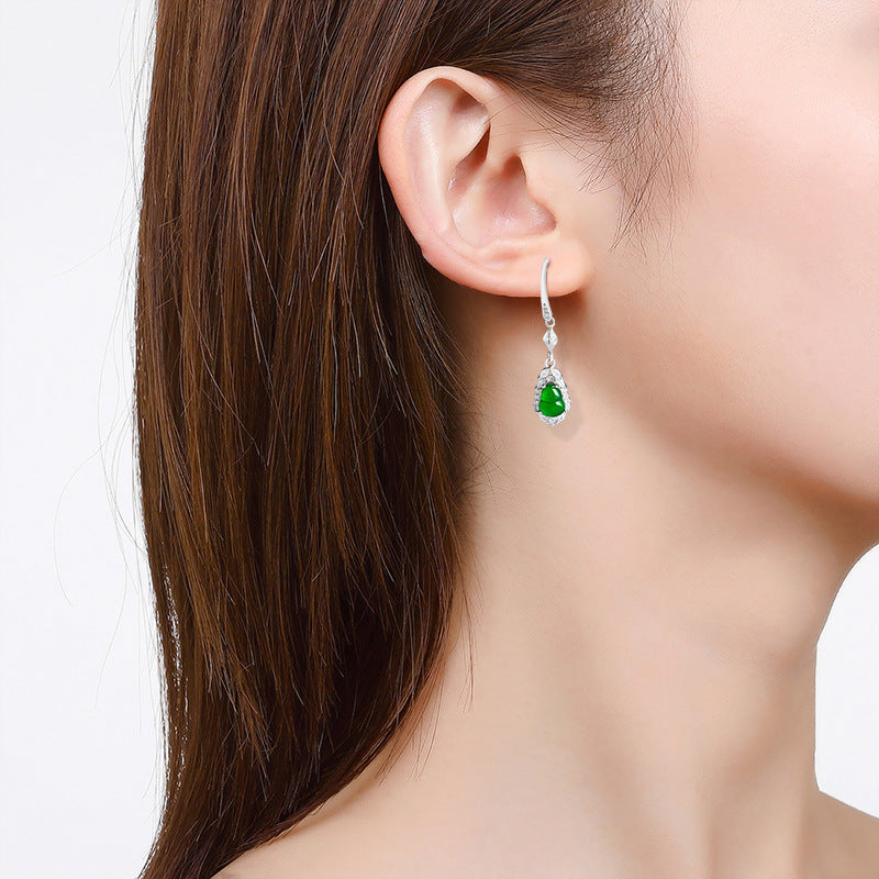 Green jade calabash earrings worn as elegant drop earrings