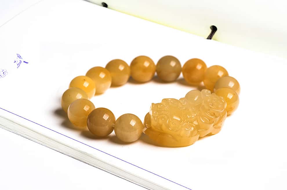 Wealth Guarding Pixiu Golden Silk Jade Bracelet