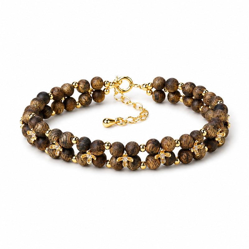 Agarwood osmanthus double-row bracelet on a clean white background