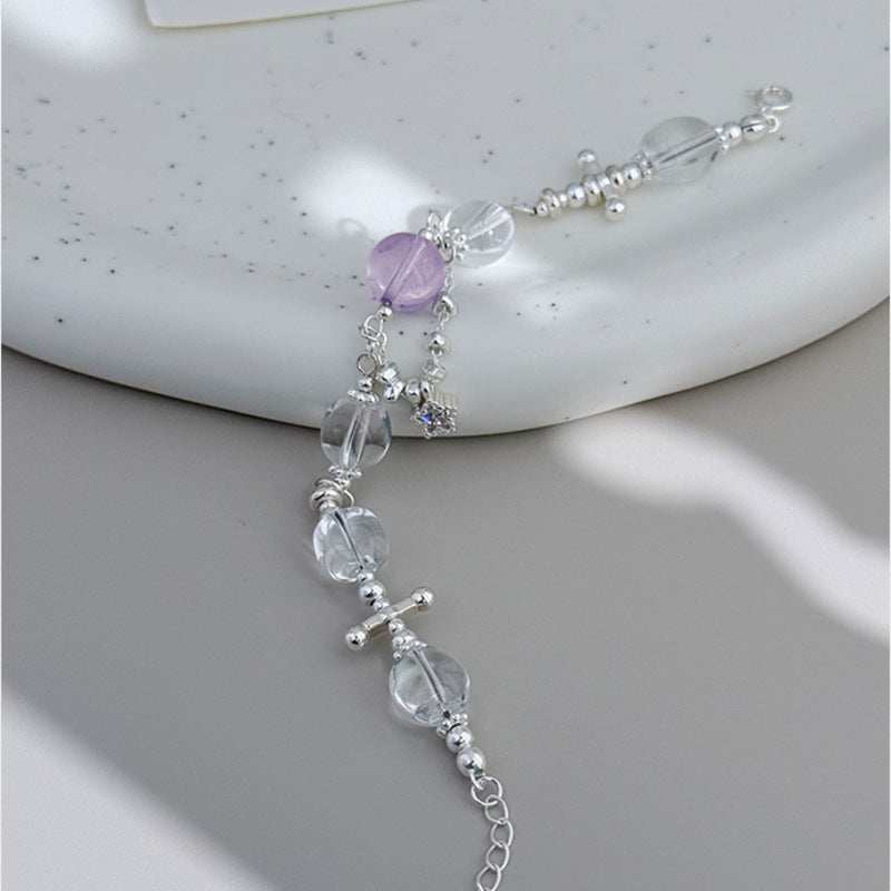 Polished amethyst and white crystal bracelet shown at full length