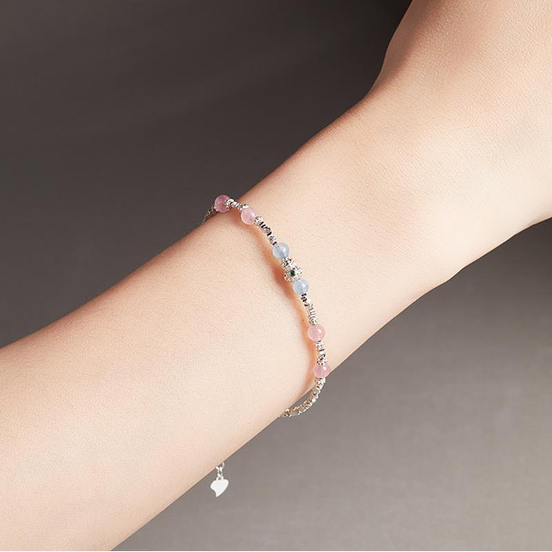 Gourd aquamarine and rose quartz bracelet on a model