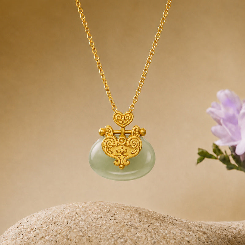 Nephrite jade auspicious cloud lock necklace in warm studio setting