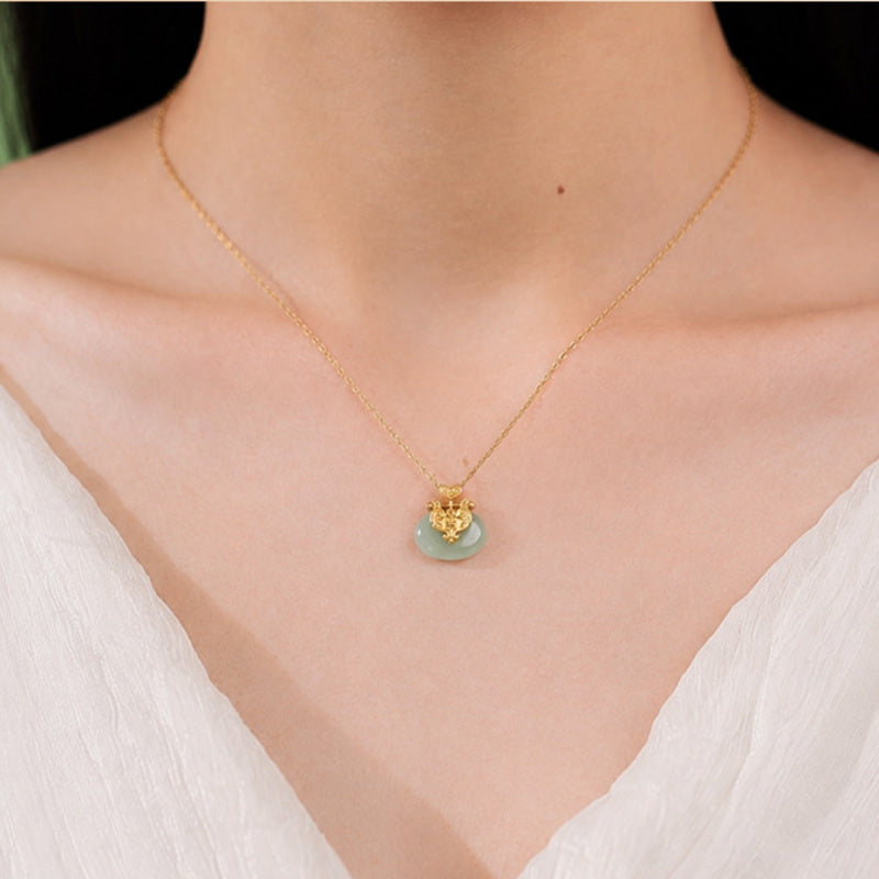 Model wearing gold-plated nephrite jade lock necklace