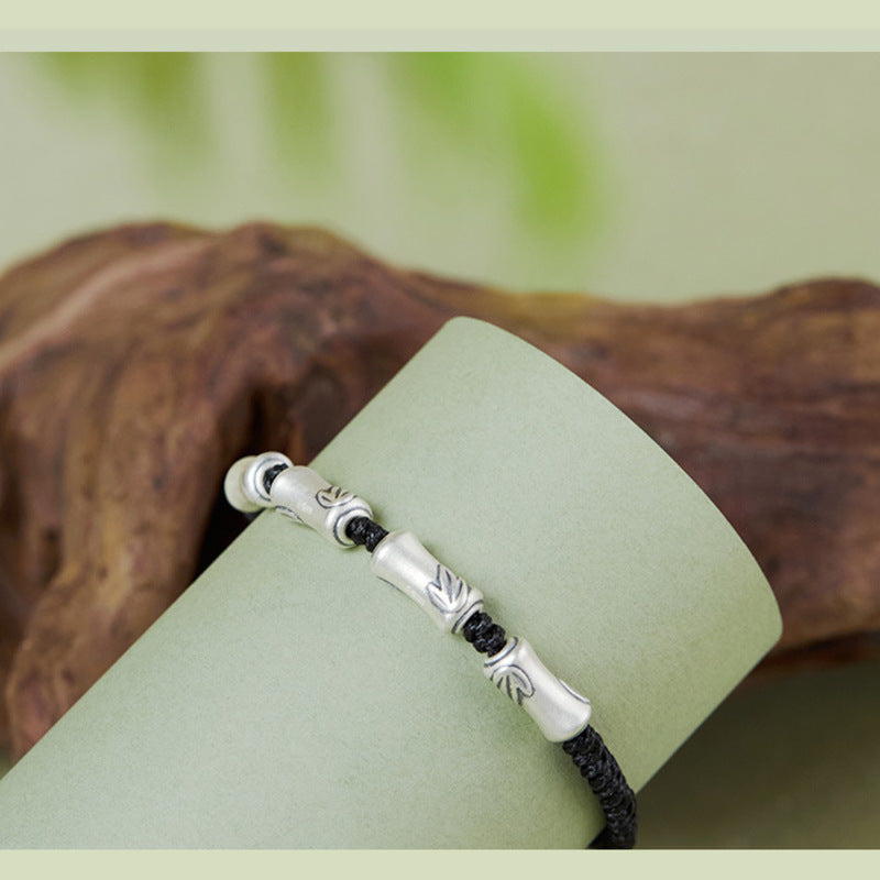 Bamboo silver bracelet detail on display prop