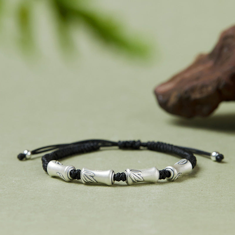 Bamboo 999 fine silver cord bracelet on sage green background