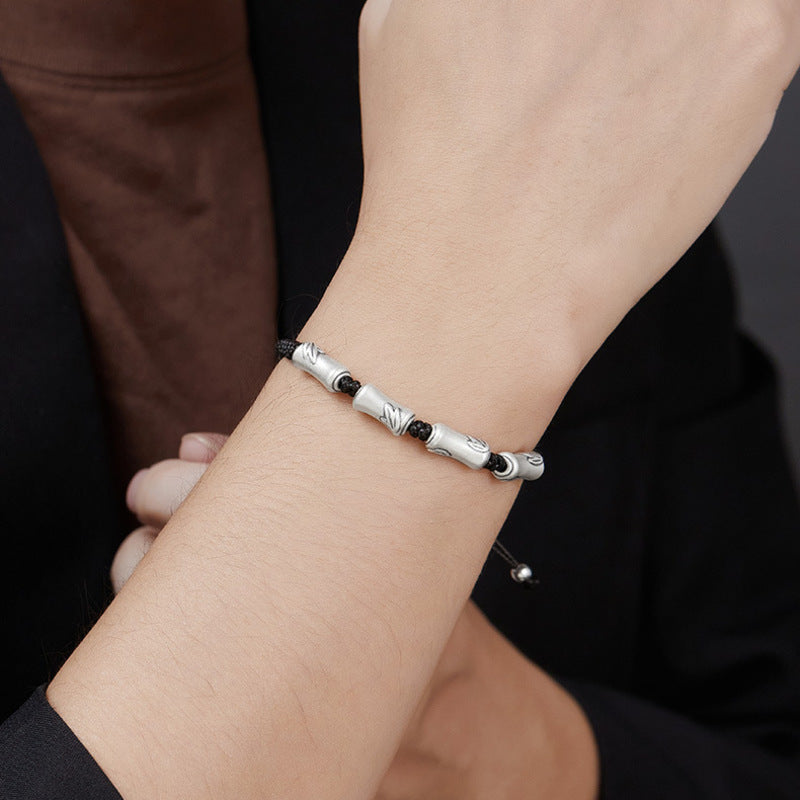 Model wearing bamboo 999 fine silver cord bracelet