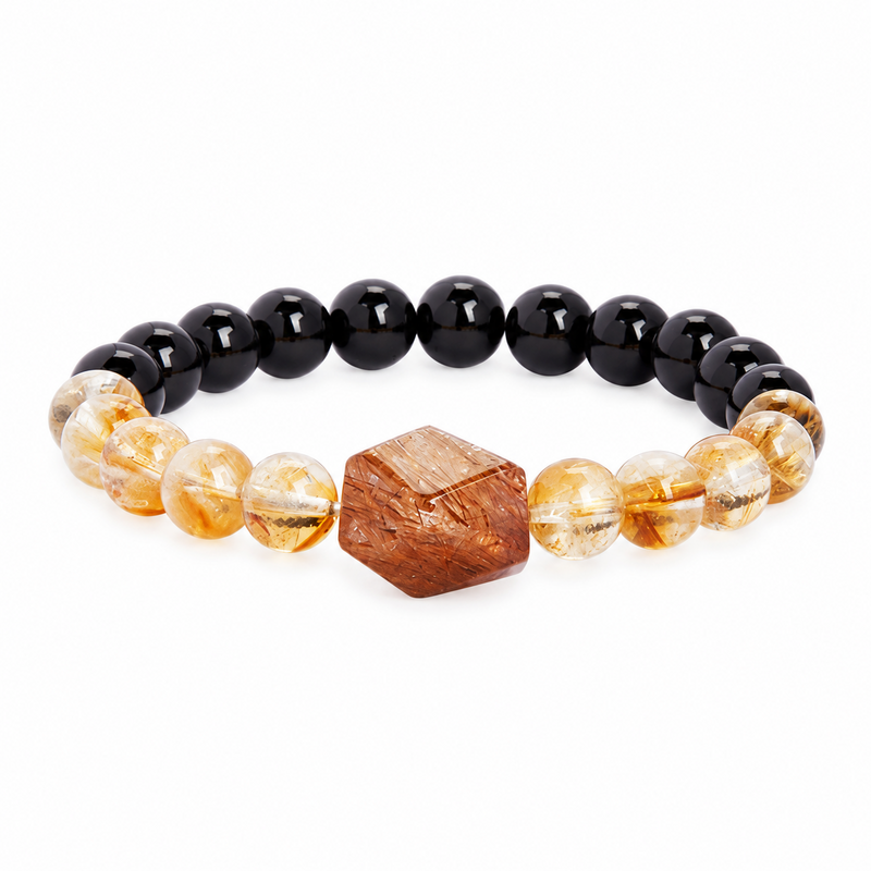 Black gold super seven obsidian bracelet on white background