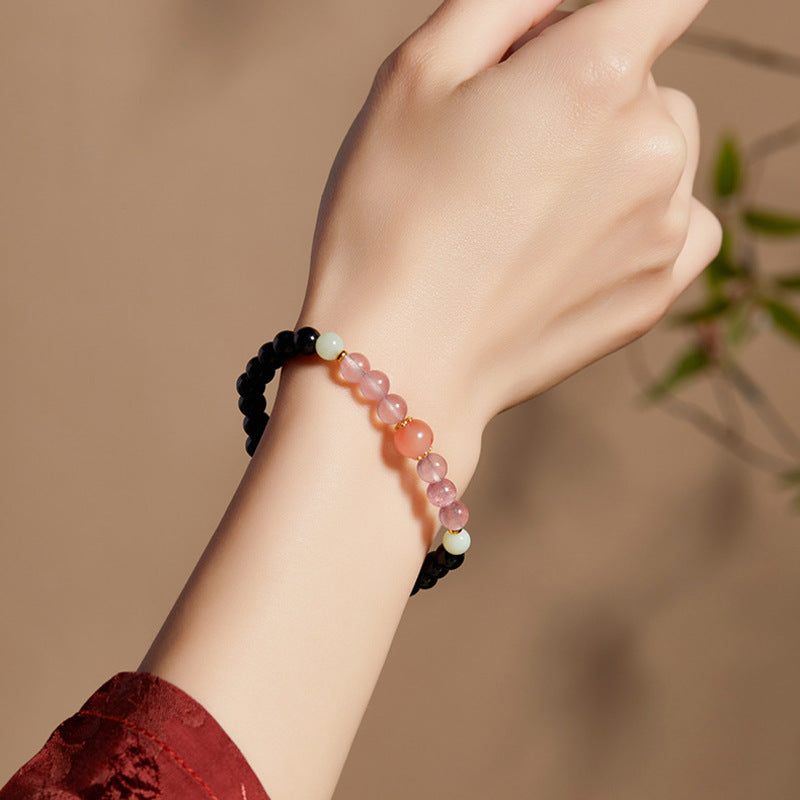 Supplier model wearing black obsidian and South Red agate stretch bracelet