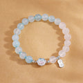 Blue agate cat paw bracelet on a warm gold backdrop