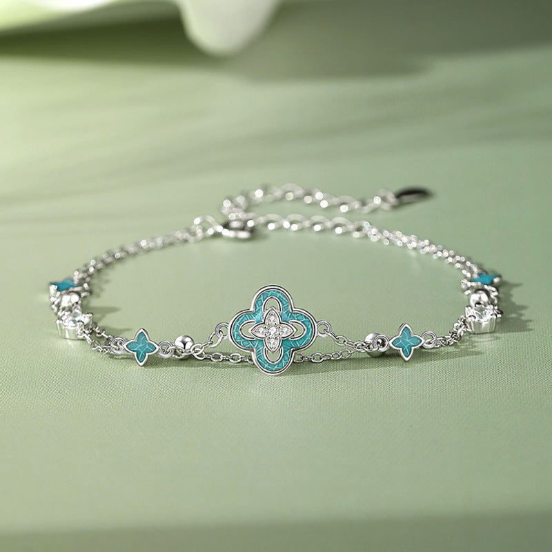Blue enamel clover silver bracelet on the original green background