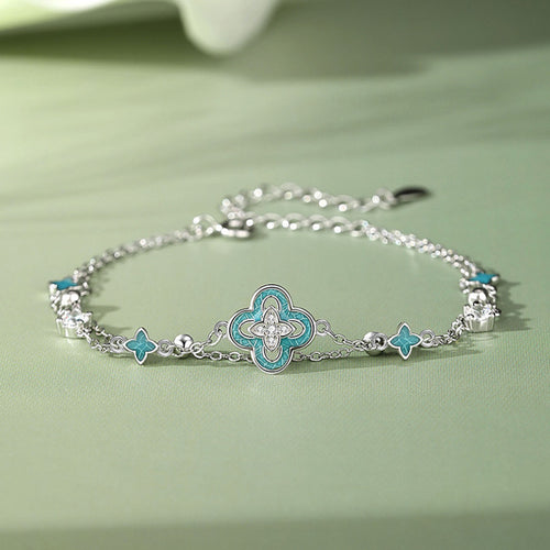 Blue enamel clover silver bracelet on the original green background