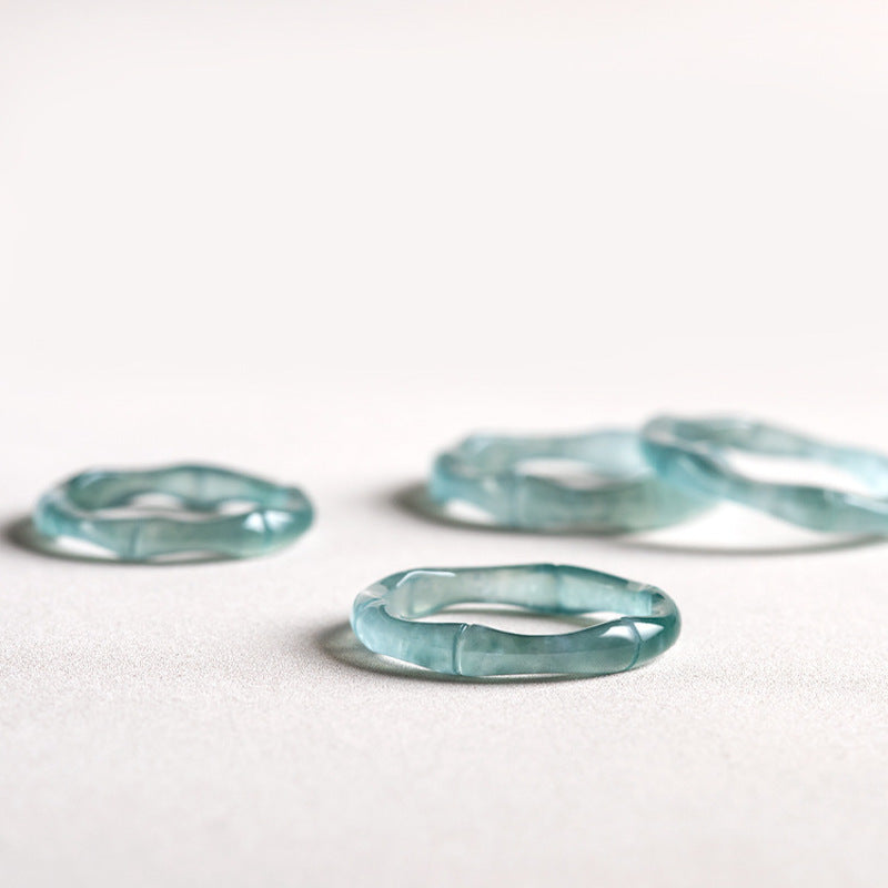 Blue water jadeite bamboo rings showing natural translucency