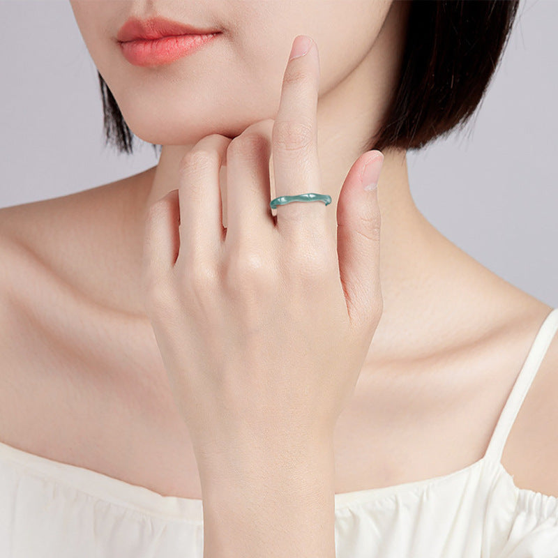 Woman wearing a blue water jadeite bamboo ring