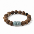 Blue water jadeite Pixiu sandalwood bracelet on white background