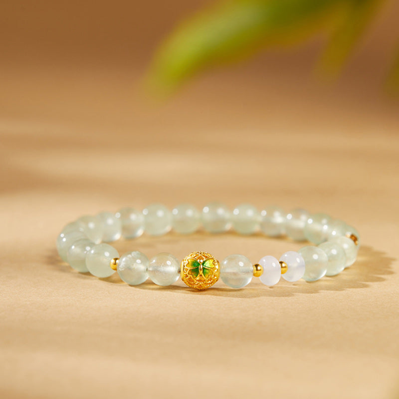 Cold enamel butterfly prehnite bracelet on a warm natural background