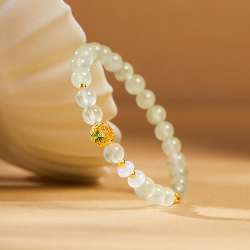 Oblique view of the cold enamel butterfly prehnite bracelet