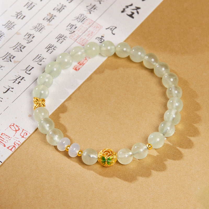 Overhead view of the cold enamel butterfly prehnite bracelet
